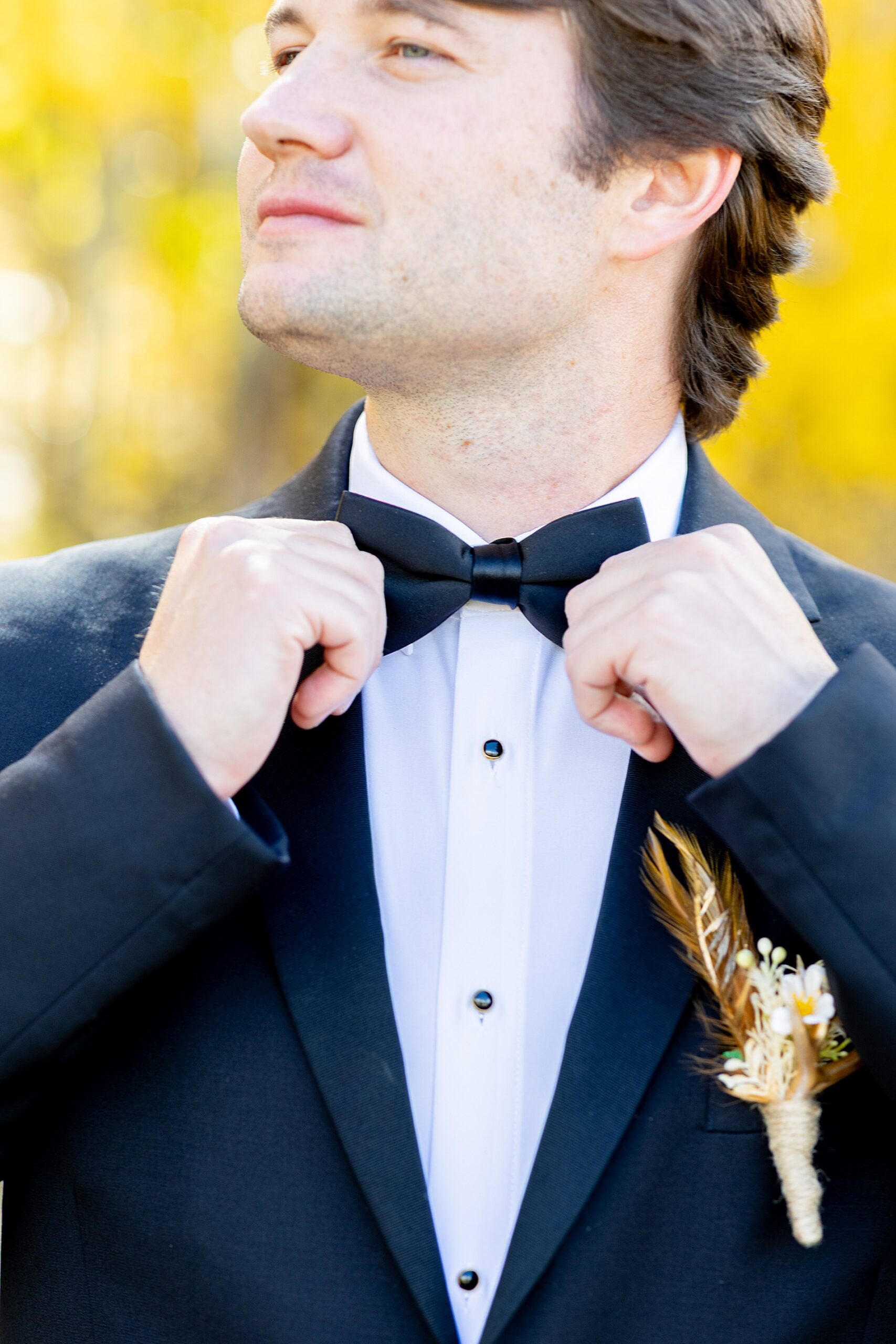 groom straightens bowtie