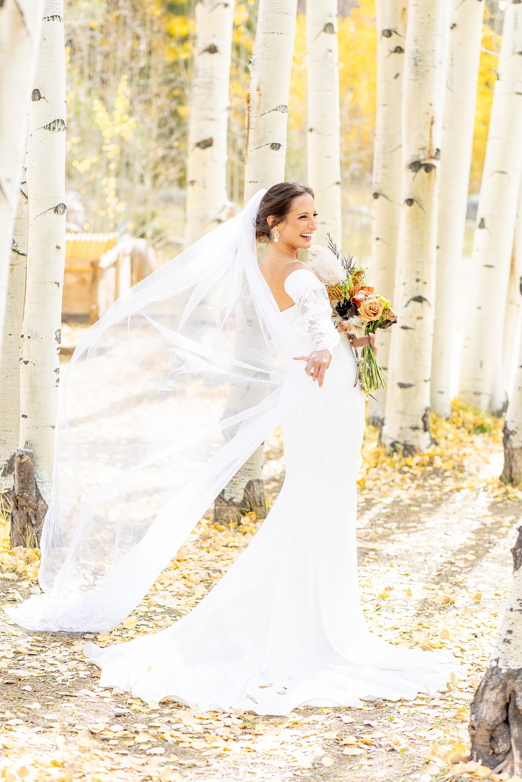 bride flowing veil around | Colorado Wedding at Beyul Retreat