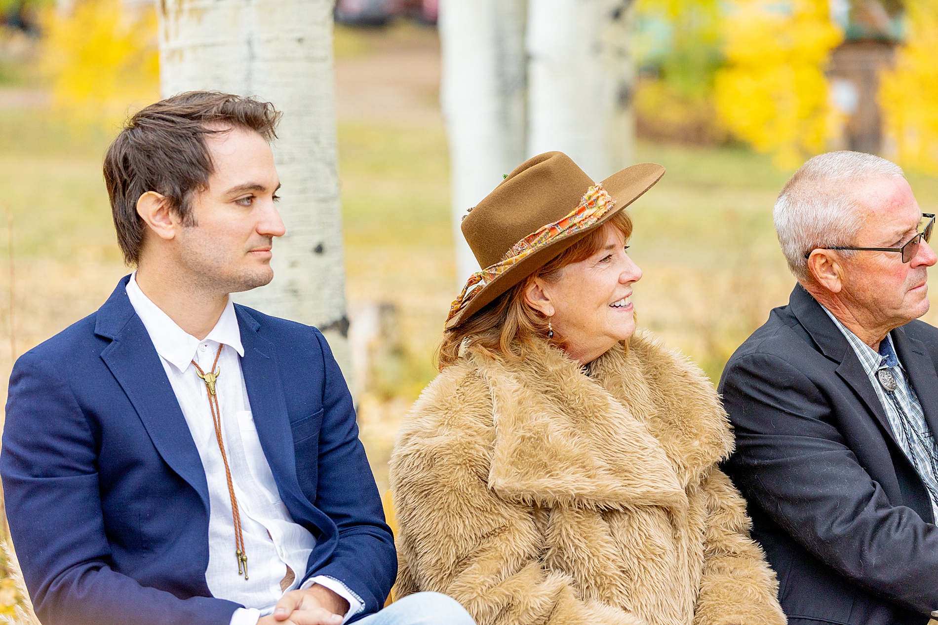 wedding guests watching bride walk down the aisle