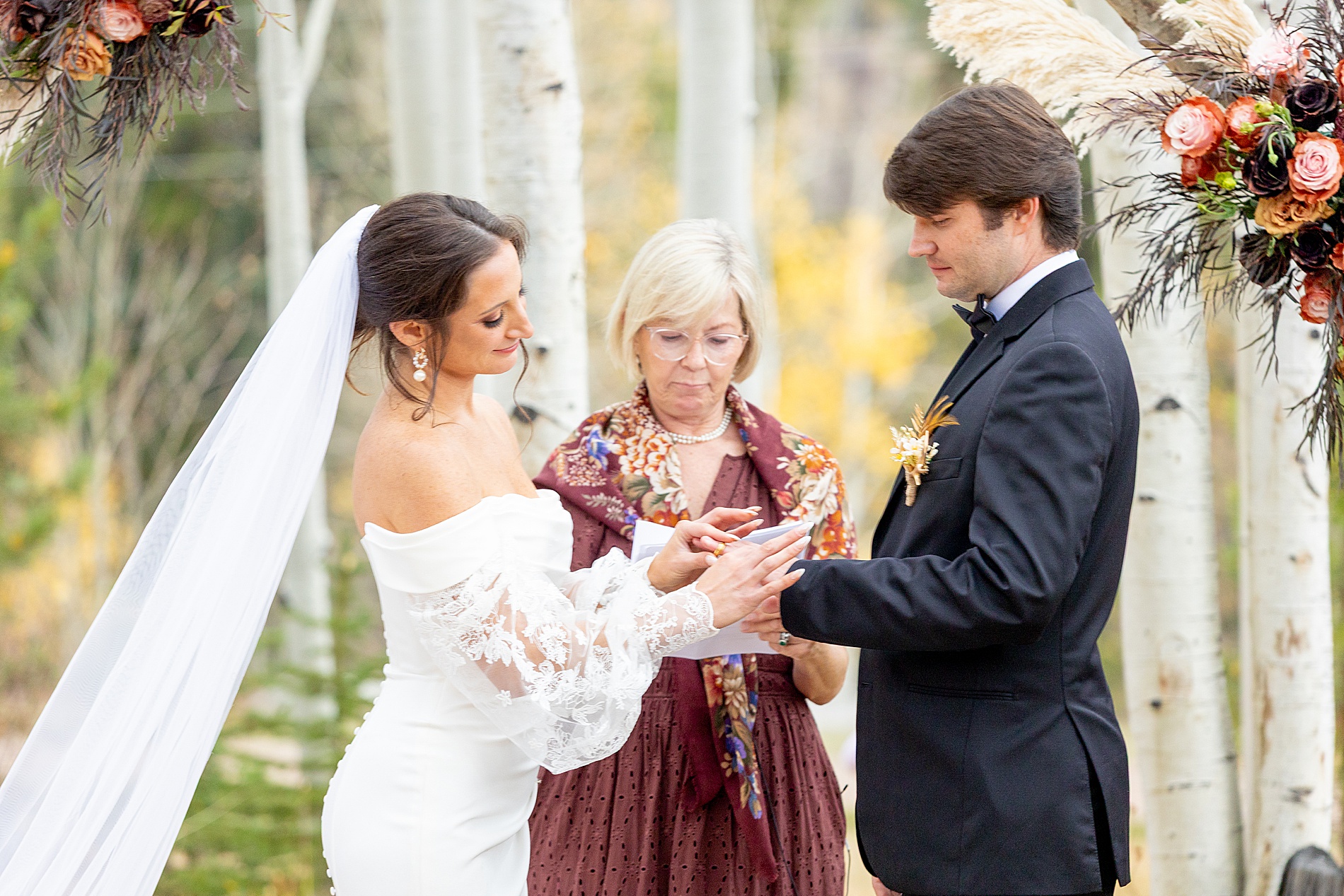 couple exchanging rings from Colorado Wedding at Beyul Retreat