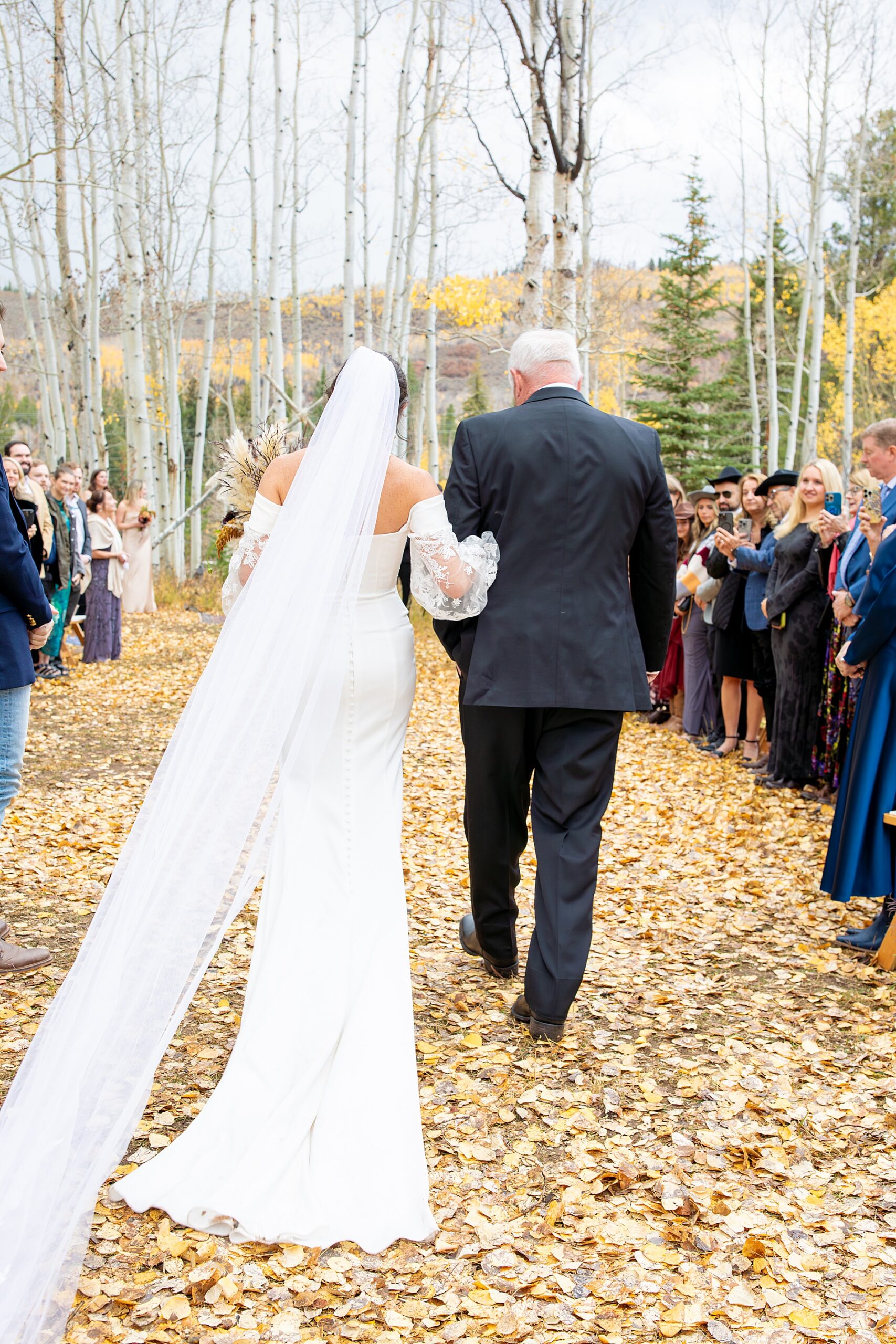bride escorted by father at Colorado Wedding at Beyul Retreat