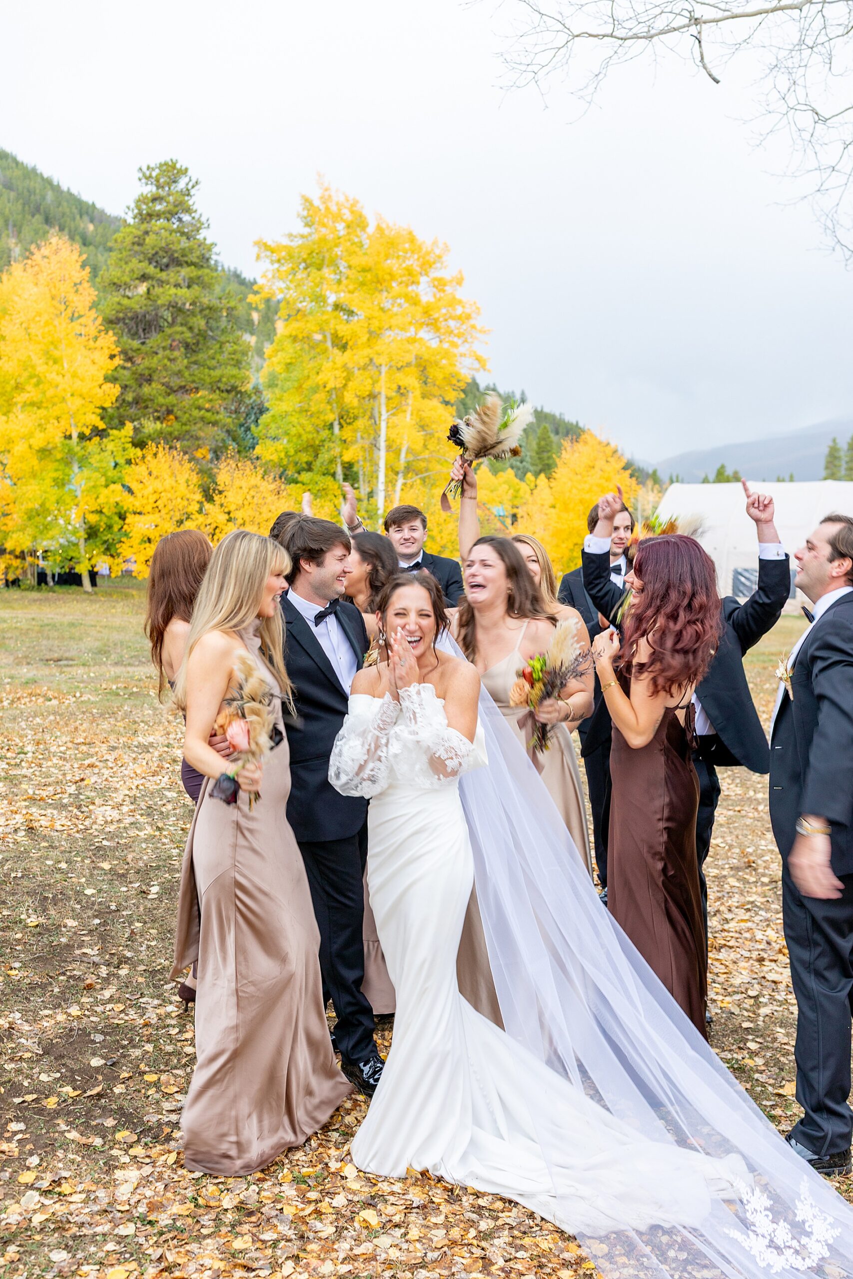 candid portraits of newlyweds with wedding party celebrating