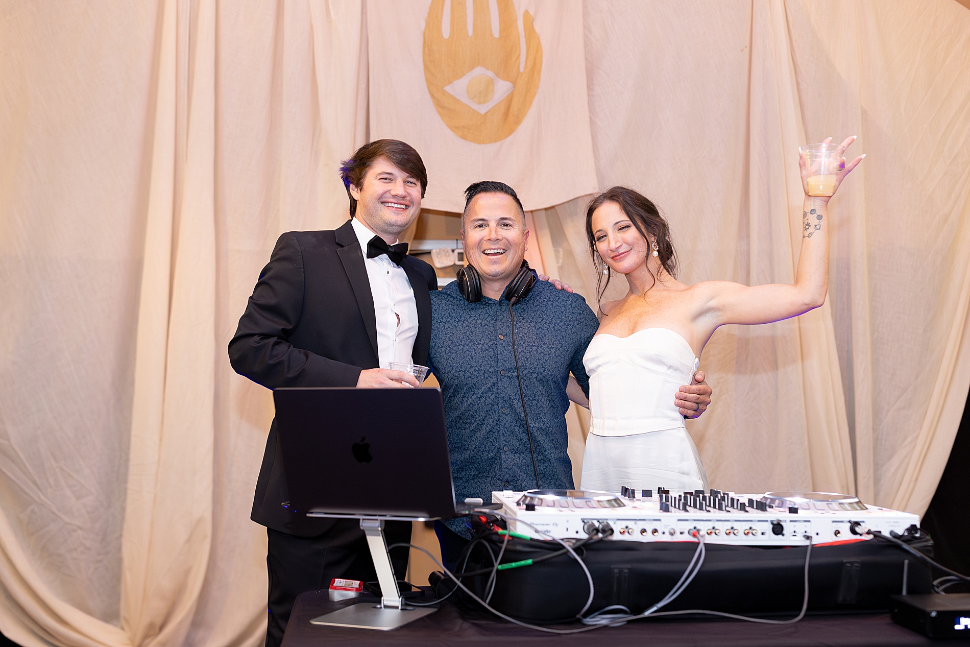 bride and groom with dj