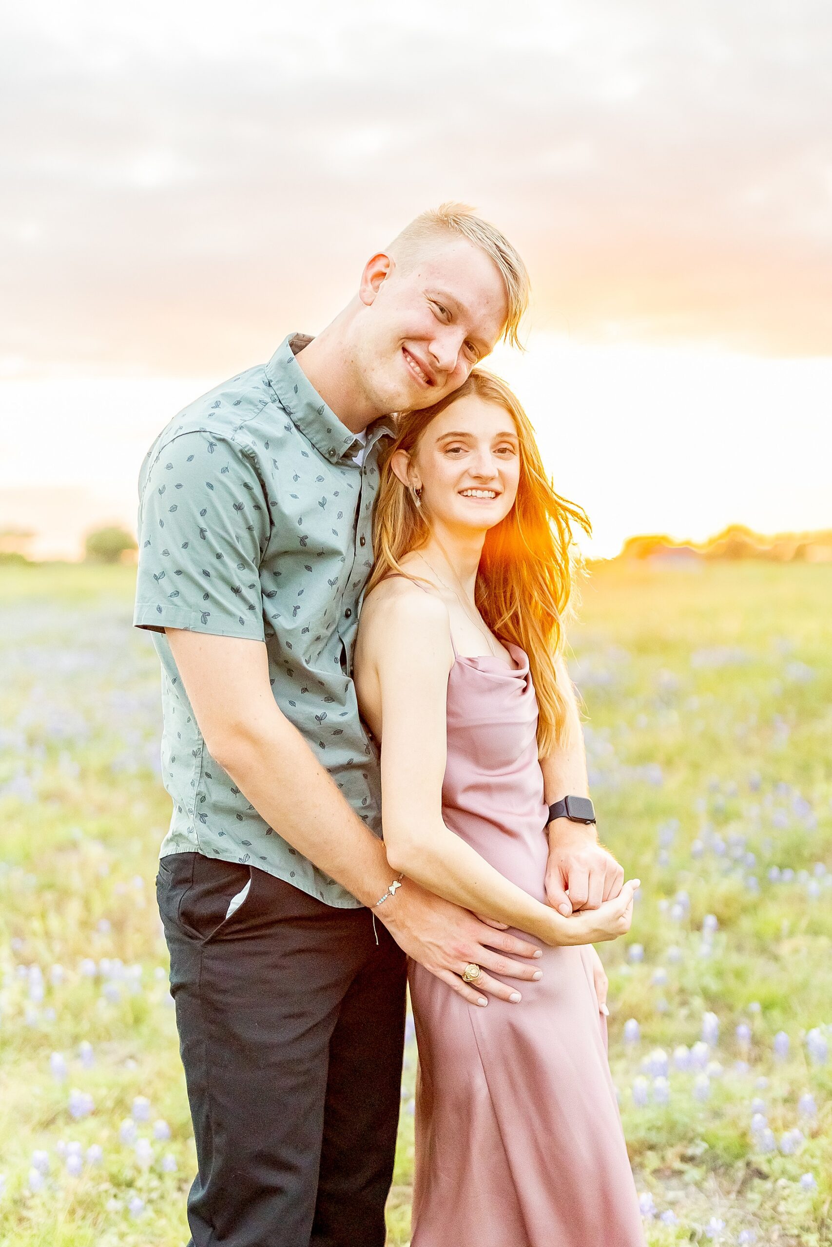 romantic sunset engagement in Brenham, TX during bluebonnet season