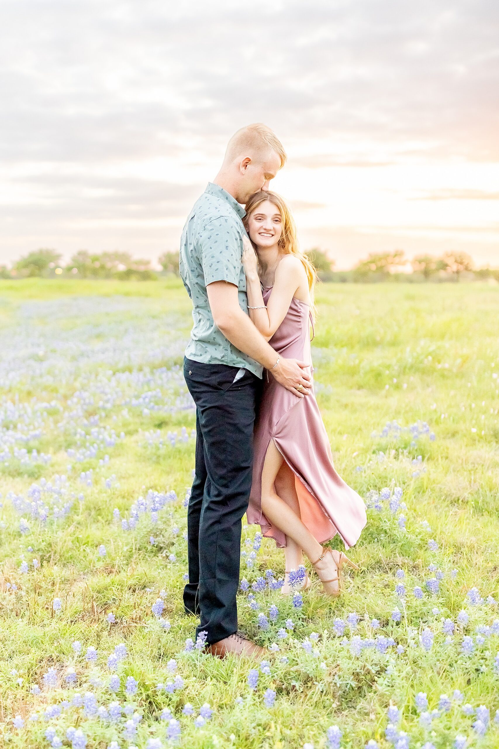 sunset engagement session in field of bluebonnets