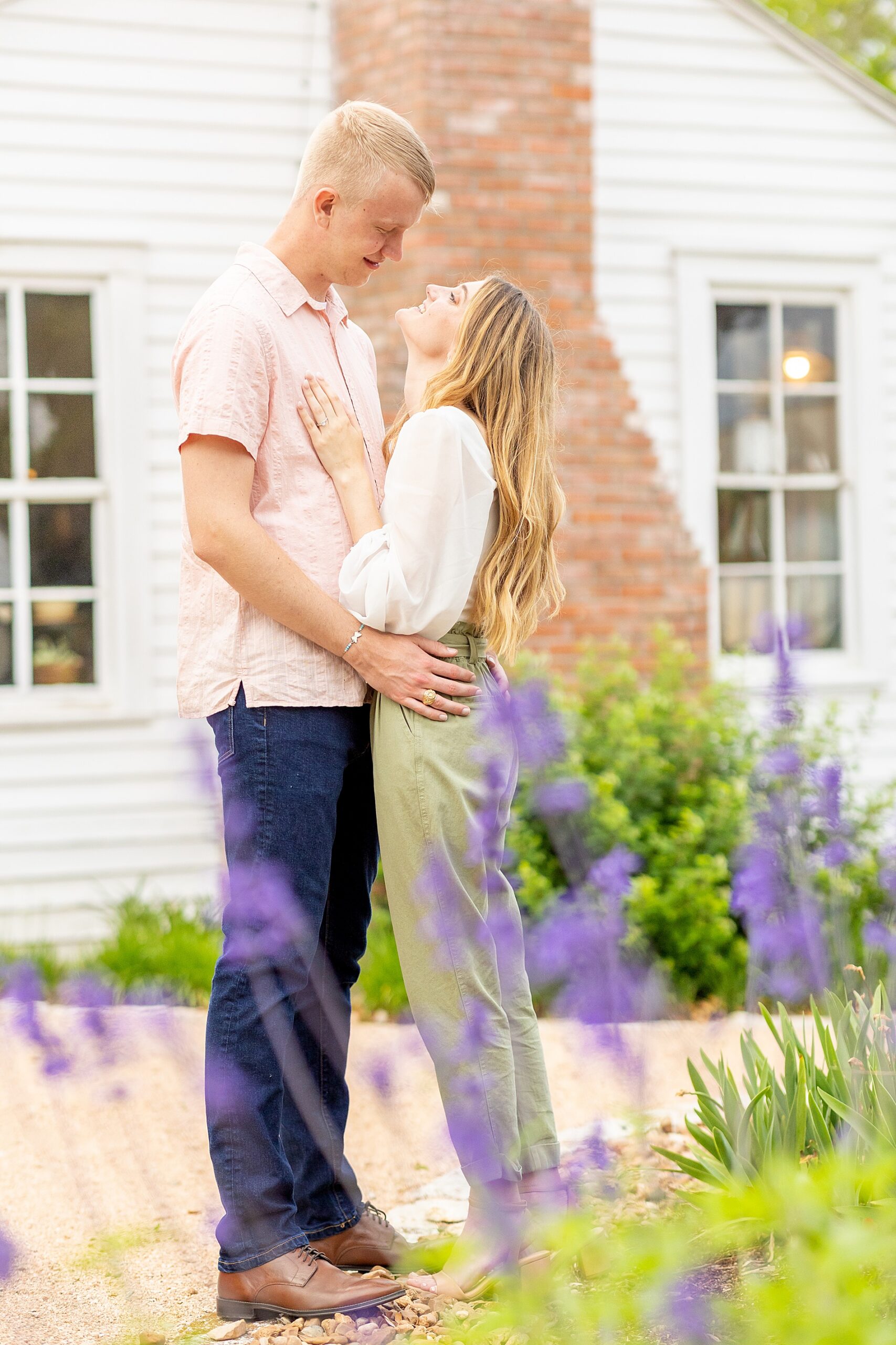 engagement photos with spring flowers in bloom