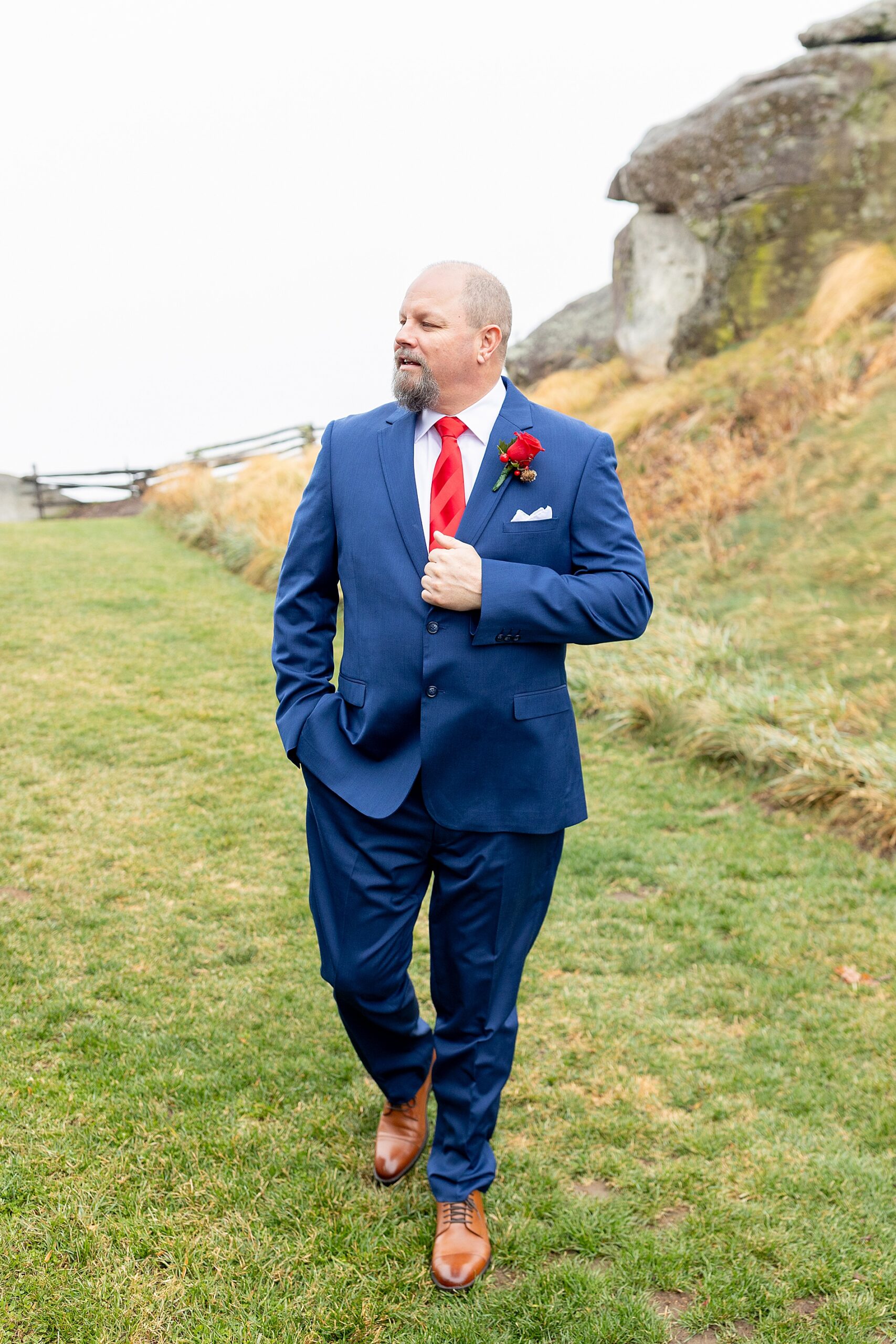 groom walking around Glassy Chapel