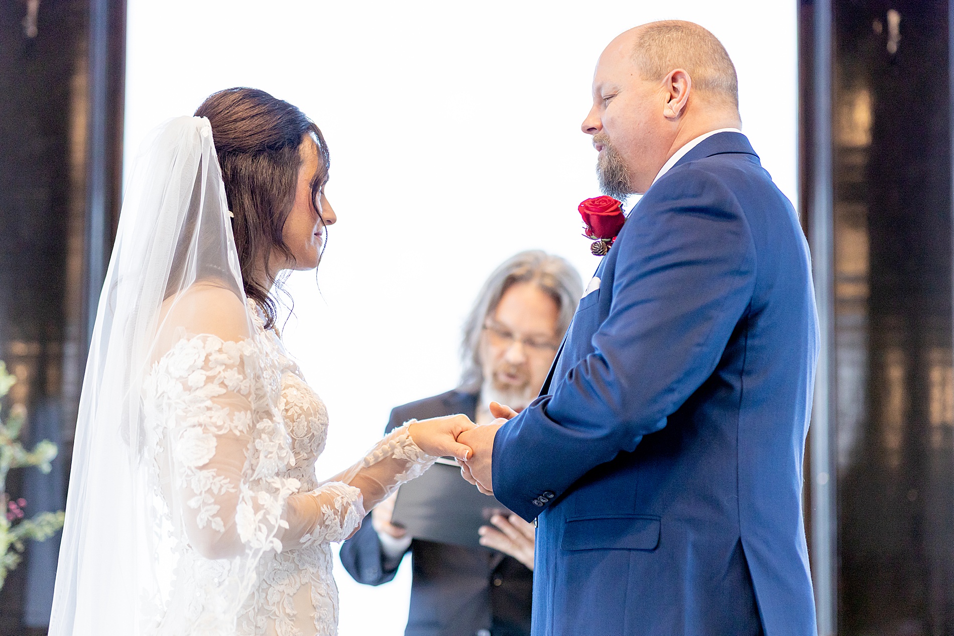 bride and groom exchanging rings