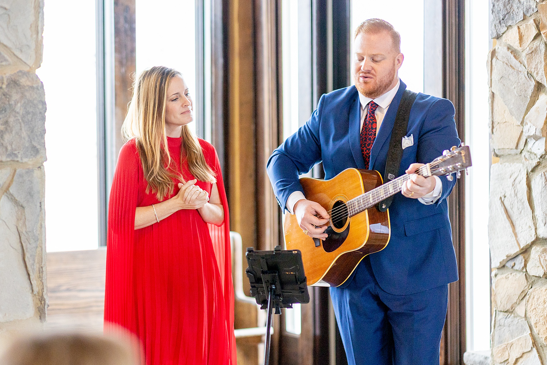 couple playing song at wedding ceremony 