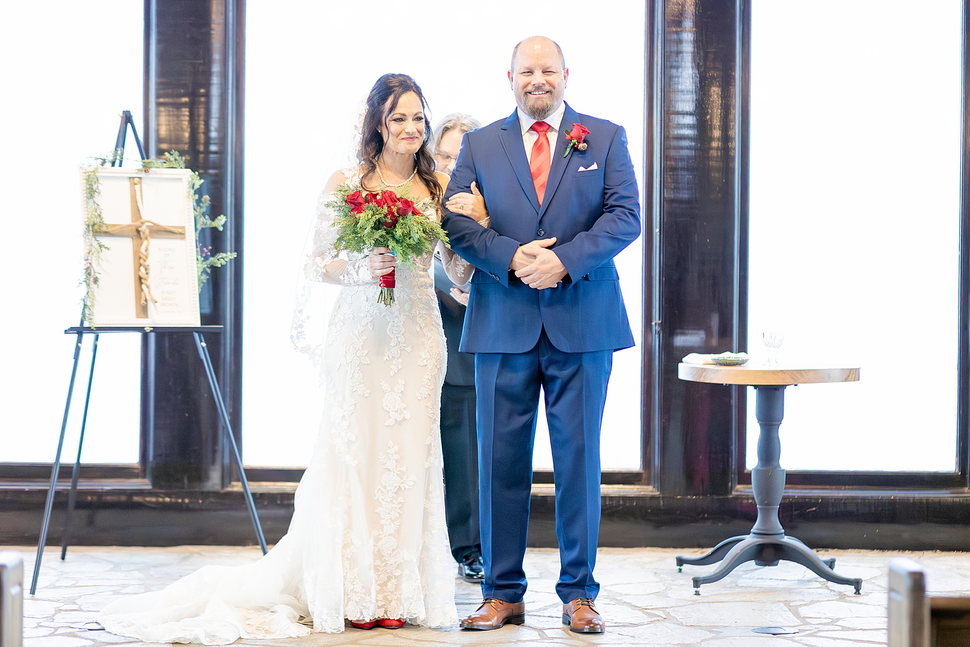 newlyweds stand before guests