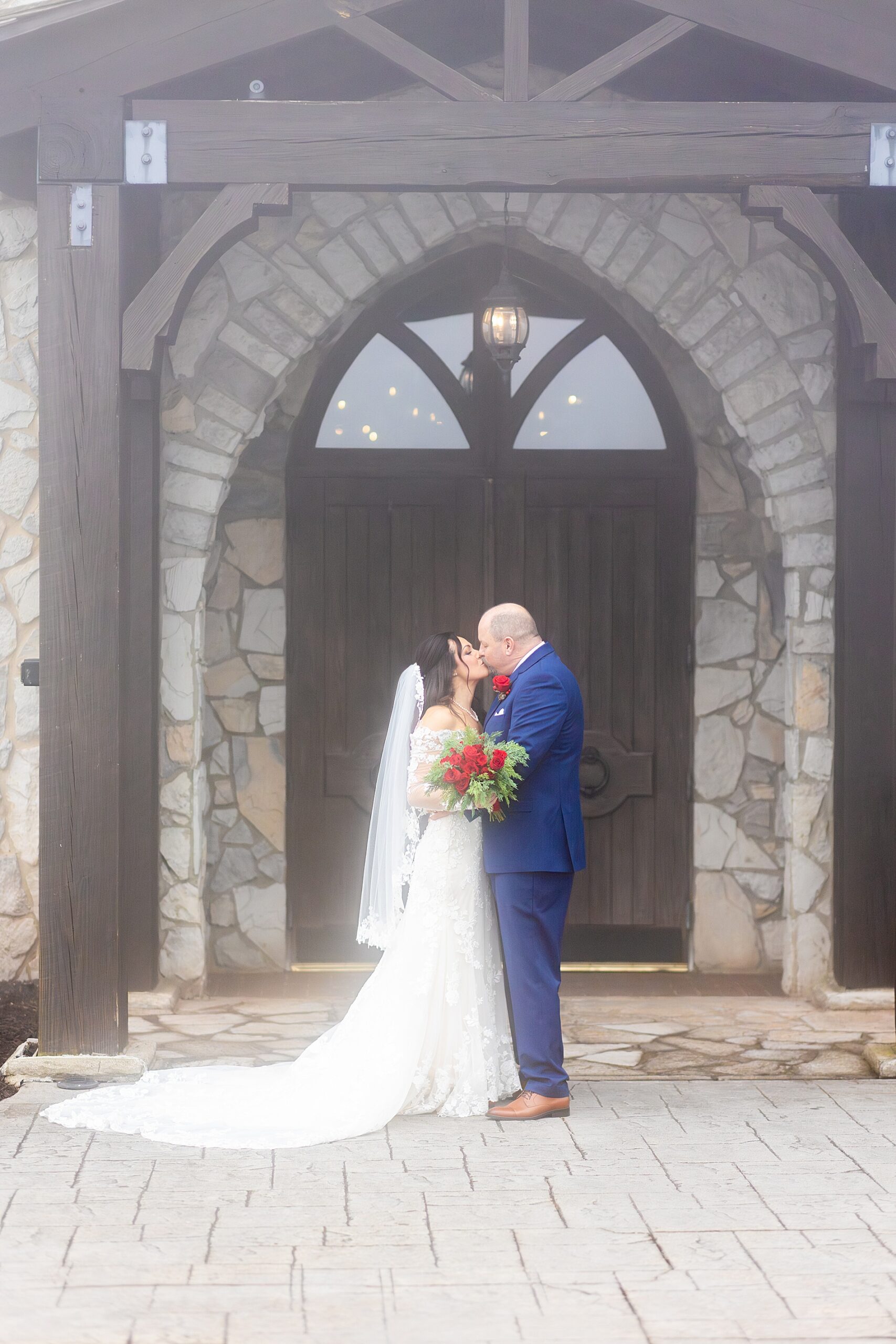 newlyweds kiss outside of chapel