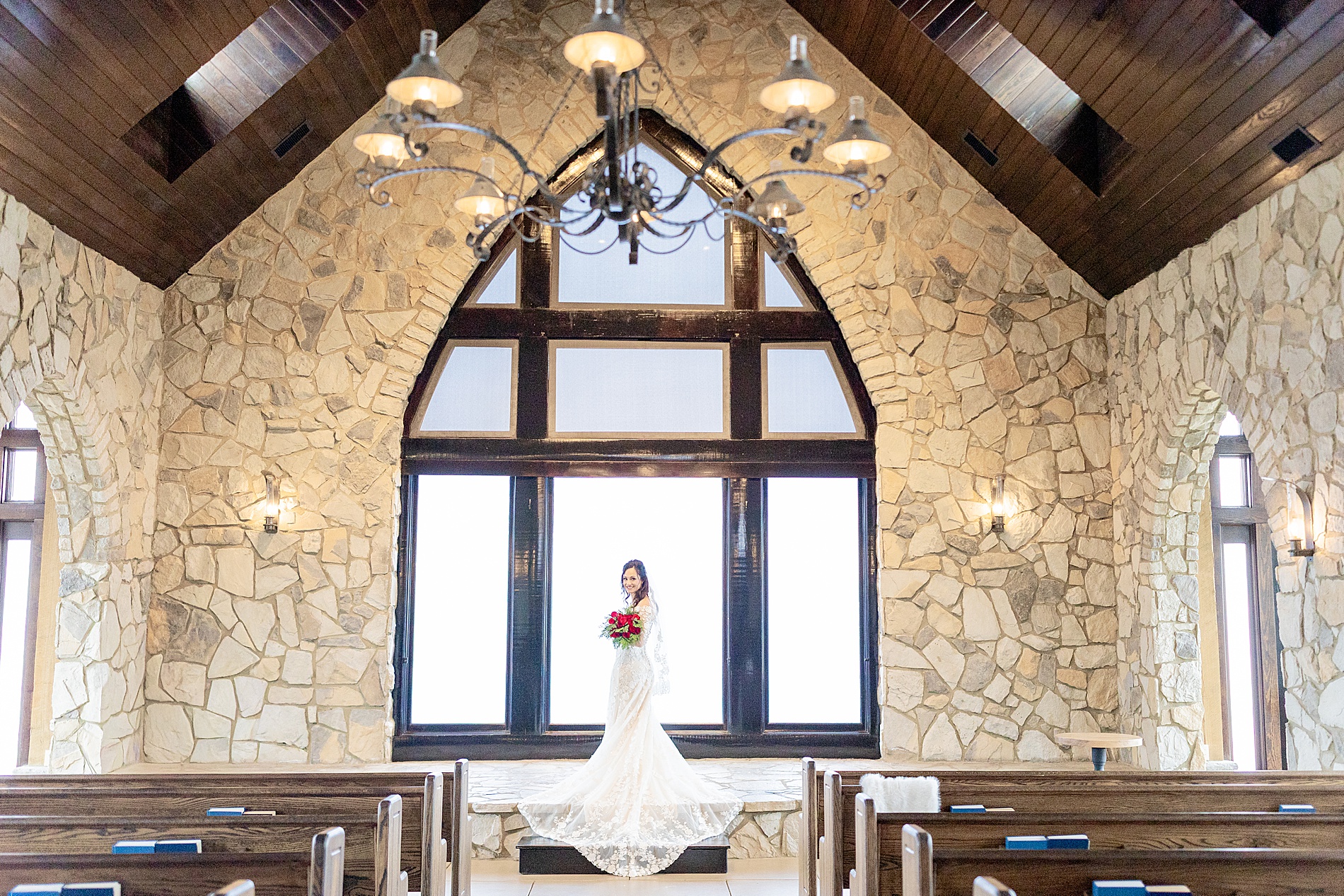 bride stands inside The cliffs at Glassy chapel 