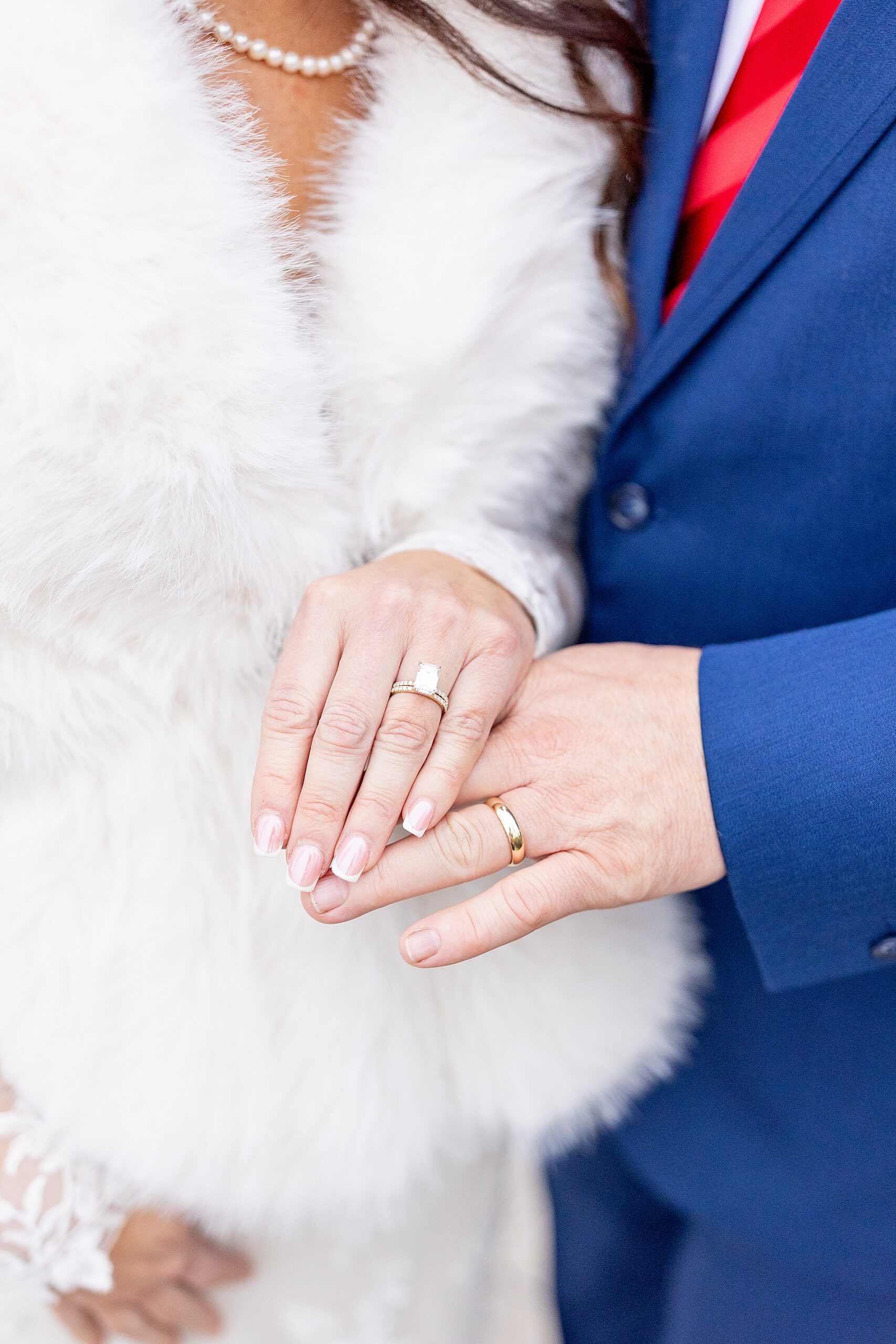 bride and groom with wedding rings 