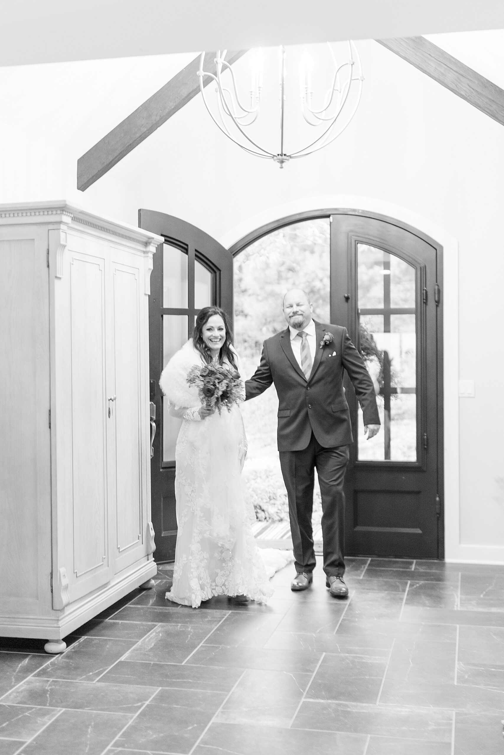 bride and groom enter intimate wedding reception at airbnb
