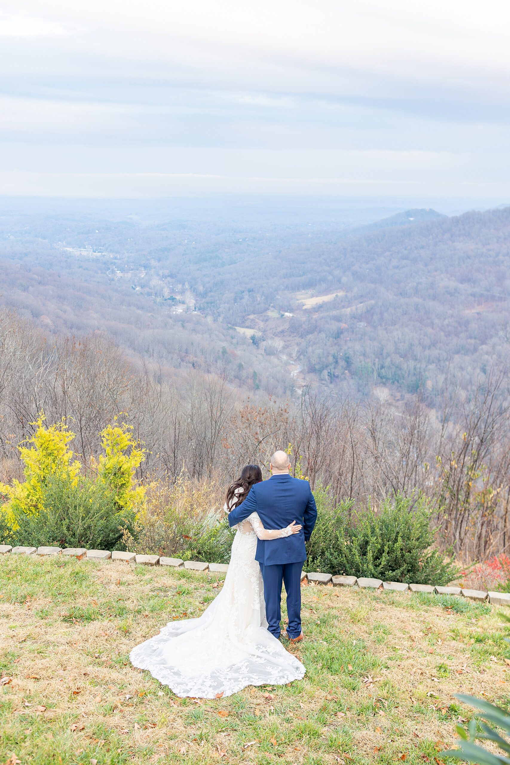 newlyweds look out at mountain view captured by Greenville, SC wedding photographer