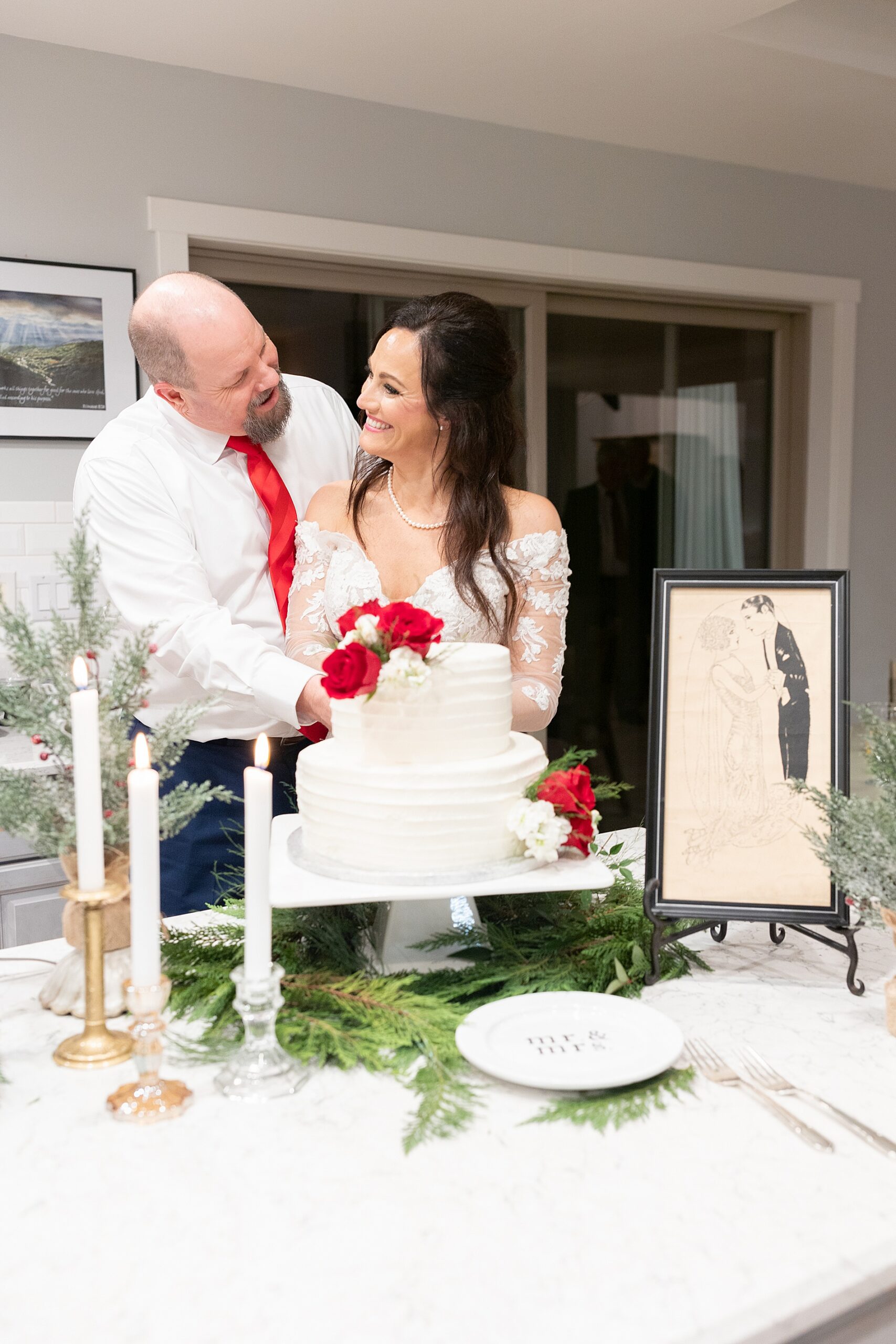 bride and groom cut wedding cake 