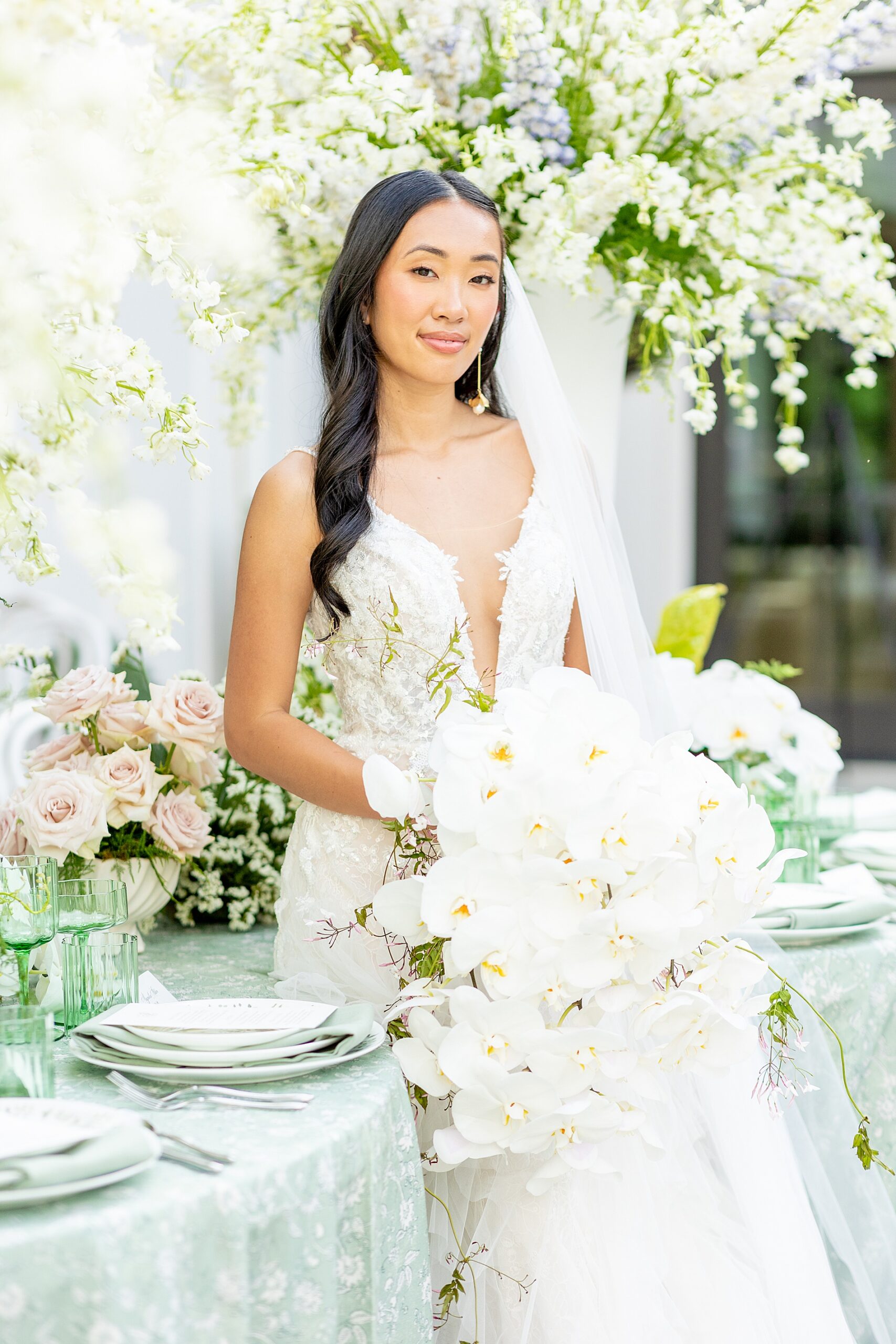 elegant bride with cascading bouquet of white lilies 