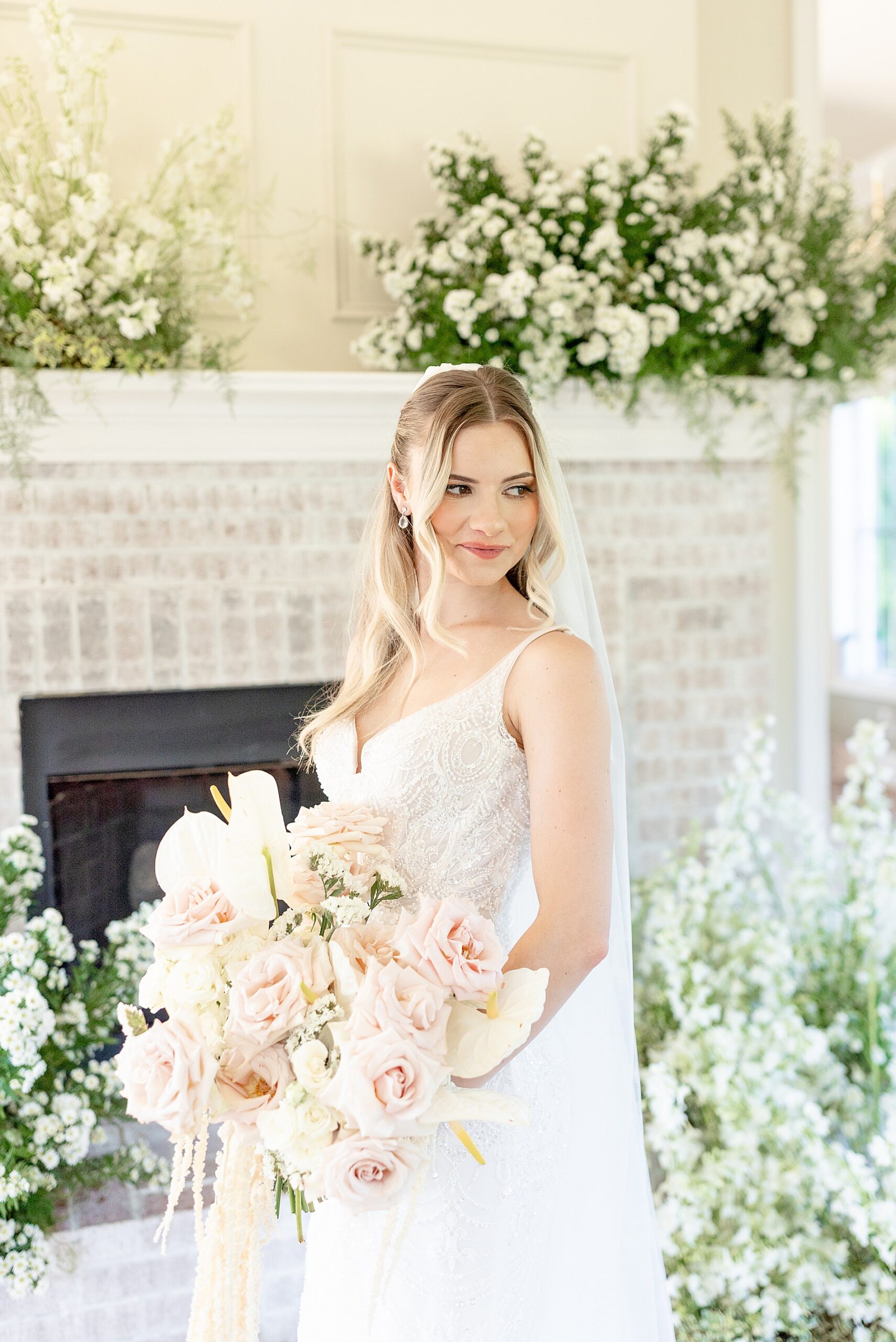 bride holding soft and elegant bridal bouquet 
