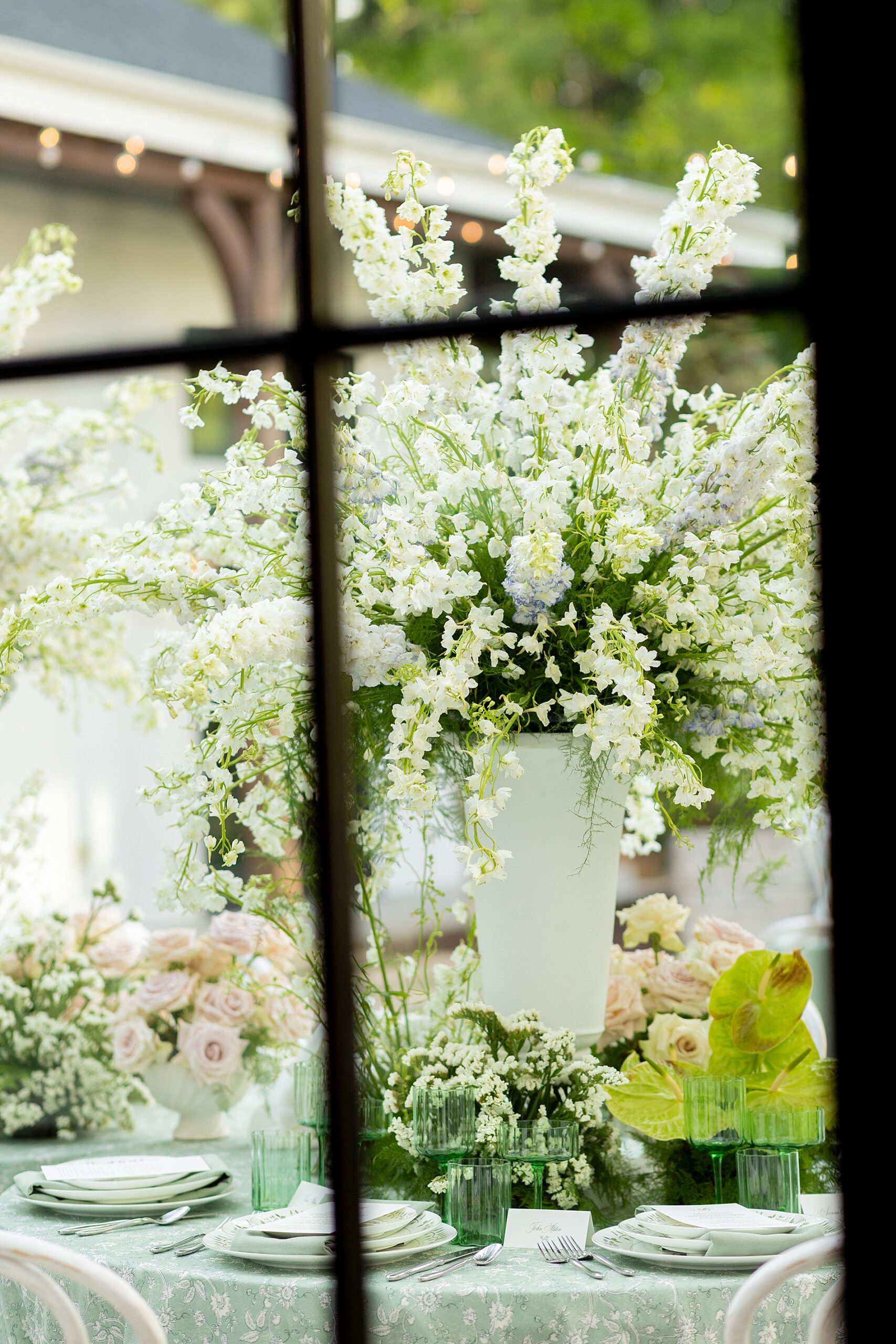 vases filled with white flowers 