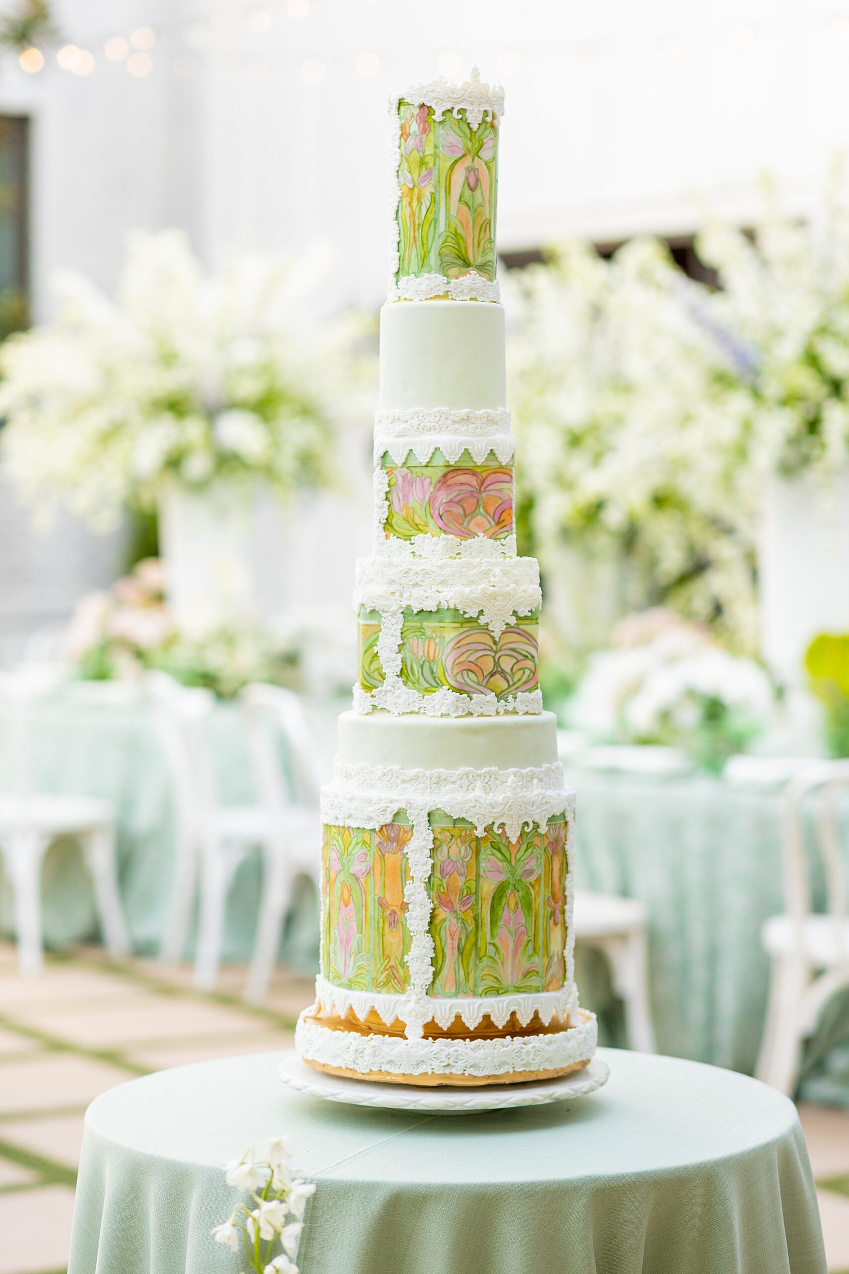 unique wedding cake with tall, thin layers 