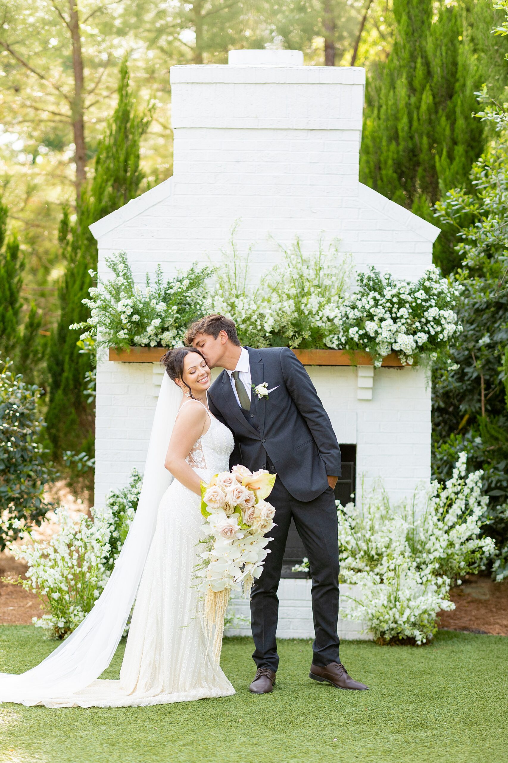 groom kisses bride's cheek